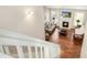 Upstairs view of living room with fireplace and hardwood floors at 506 Misty Willow Way, Rolesville, NC 27571