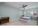 Serene bedroom with ceiling fan, ample natural light, and neutral color palette at 5315 Oakbrook Dr, Durham, NC 27713