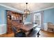 Charming dining room with hardwood floors and built-in hutch at 5315 Oakbrook Dr, Durham, NC 27713