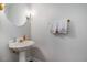 Elegant powder room with pedestal sink and decorative mirror at 6 Montcrest Dr, Durham, NC 27713