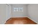 Bedroom with hardwood floors, double closet and window at 624 Oakgrove Dr, Graham, NC 27253