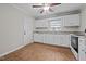 Bright kitchen features granite countertops, white cabinets, and tile floors at 624 Oakgrove Dr, Graham, NC 27253