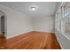 Hardwood floor living room with an archway at 624 Oakgrove Dr, Graham, NC 27253