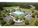 Aerial view of community pool with lap lanes, pool, clubhouse, tennis courts, sports field and parking at 64 Barn Owl, Pittsboro, NC 27312