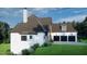 Beautiful two-story home showcasing siding accents, complemented by a three-car garage and lush landscaping at 64 Barn Owl, Pittsboro, NC 27312