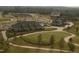 Beautiful aerial view of a golf course with lush green fairways and manicured landscaping in a planned residential community at 64 Barn Owl, Pittsboro, NC 27312