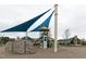 Fun playground with climbing wall, slides, and shaded areas, providing a safe and enjoyable space for children at 64 Barn Owl, Pittsboro, NC 27312