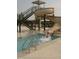 Community pool featuring a slide and wading area, perfect for families and outdoor recreation within a residential community at 64 Barn Owl, Pittsboro, NC 27312