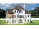 This home features a covered outdoor space on the main level and a large deck on the upper level at 64 Barn Owl, Pittsboro, NC 27312