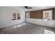 Bright bedroom featuring wood accent wall and large windows at 68 Spring Leaf Ln, Wendell, NC 27591