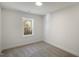 Bright bedroom with carpeted floor and a window offering natural light at 68 Spring Leaf Ln, Wendell, NC 27591