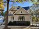 Two-story house with gray siding, stone accents, and a covered porch at 68 Spring Leaf Ln, Wendell, NC 27591