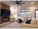 Light-filled living area featuring a modern electric fireplace at 68 Spring Leaf Ln, Wendell, NC 27591