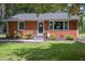 Brick ranch house with landscaped yard and spacious windows at 741 C Isley Road, Haw River, NC 27258