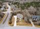 An aerial view of this gorgeous home with a 3-car garage and mature landscaping at 7416 Capulin Crest Dr, Apex, NC 27539