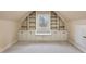 Spacious attic featuring built-in shelving and cabinets, perfect for extra storage at 7416 Capulin Crest Dr, Apex, NC 27539