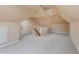 Large attic space with neutral carpeting, ready for customization or extra storage at 7416 Capulin Crest Dr, Apex, NC 27539