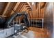 Unfinished attic showcasing wooden beams and ample space for potential development at 7416 Capulin Crest Dr, Apex, NC 27539