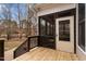 Spacious back porch featuring wood railings, a door to the home and stairs to the yard at 7416 Capulin Crest Dr, Apex, NC 27539