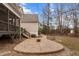 Beautifully designed patio with a fire pit, perfect for entertaining and relaxing in the serene backyard setting at 7416 Capulin Crest Dr, Apex, NC 27539