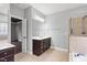 Bathroom featuring a vanity, large mirror, with access to bedroom and shower and tub combo at 7416 Capulin Crest Dr, Apex, NC 27539