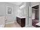 Bright bathroom with a vanity and view into the connecting room at 7416 Capulin Crest Dr, Apex, NC 27539