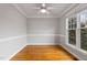 Neutral bedroom with hardwood floors and bright natural light at 7416 Capulin Crest Dr, Apex, NC 27539