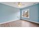 A well-lit bedroom featuring a large window and floating shelving at 7416 Capulin Crest Dr, Apex, NC 27539