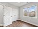 Spacious bedroom featuring wood floors and double closets at 7416 Capulin Crest Dr, Apex, NC 27539