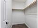 Walk-in closet provides ample storage space with rods for hanging clothes at 7416 Capulin Crest Dr, Apex, NC 27539