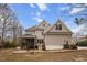 Charming two-story home with screened porch, patio, and well-maintained exterior at 7416 Capulin Crest Dr, Apex, NC 27539