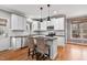 Updated kitchen with white cabinets, stainless appliances, and island seating at 7416 Capulin Crest Dr, Apex, NC 27539