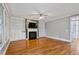 Bright living room boasts hardwood floors, fireplace, and built-in bookshelves at 7416 Capulin Crest Dr, Apex, NC 27539