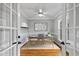 Bright office space with hardwood floors, natural light, and neutral paint provides a quiet workspace at 7416 Capulin Crest Dr, Apex, NC 27539