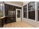 Relaxing screened porch with wood decking, screened walls, and comfortable seating at 7416 Capulin Crest Dr, Apex, NC 27539