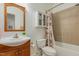 Clean bathroom with shower/tub and wood vanity at 920 E Jones St, Raleigh, NC 27601