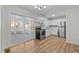 Modern kitchen with stainless steel appliances and access to a screened porch at 1014 Holden Rd Rd, Youngsville, NC 27596