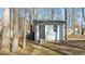 White storage shed in backyard with stone pathway at 1014 Holden Rd Rd, Youngsville, NC 27596