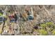 Aerial view showcasing the property, surrounding homes, and proximity to wooded areas at 1014 Holden Rd, Youngsville, NC 27596