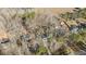 Aerial view showcasing the house and its proximity to other properties and a road at 1014 Holden Rd, Youngsville, NC 27596
