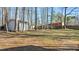 Spacious backyard with mature trees and a storage shed at 1014 Holden Rd, Youngsville, NC 27596