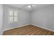 A relaxing bedroom with ceiling fan, a bright window and durable laminate flooring at 1014 Holden Rd, Youngsville, NC 27596
