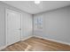 A comfortable bedroom with laminate floors, a bright window and closet for storage at 1014 Holden Rd, Youngsville, NC 27596