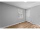 Comfortable bedroom features durable laminate flooring, a bright window, and closet for storage at 1014 Holden Rd, Youngsville, NC 27596