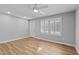 Large bedroom with vinyl floors, exterior door and new ceiling fan at 1014 Holden Rd, Youngsville, NC 27596
