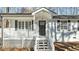 Close-up of front entrance with white trim, black door with glass inserts, and a well-kept lawn at 1014 Holden Rd, Youngsville, NC 27596