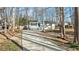 Charming home featuring a covered front porch and a long driveway at 1014 Holden Rd, Youngsville, NC 27596