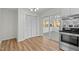Open kitchen area features new oven and sliding doors to porch and closet at 1014 Holden Rd, Youngsville, NC 27596