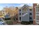 Exterior view of a townhome with brick and gray siding at 1061 Wirewood Dr # 102, Raleigh, NC 27605