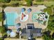 Aerial view of community pool with slides and lap lanes at 109 Aspenridge Dr, Holly Springs, NC 27540